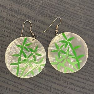 Green leaf painted large round earrings.